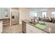 Open kitchen featuring granite countertops, stainless steel appliances, and seamless access to the living area at 1132 Ruby Sparrow St, Henderson, NV 89011
