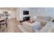 Bright, open-concept living room with modern furnishings and a large sectional couch at 1132 Ruby Sparrow St, Henderson, NV 89011