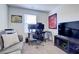 Comfortable home office with desk, seating, and entertainment center at 1132 Ruby Sparrow St, Henderson, NV 89011