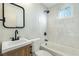 Nicely remodeled bathroom with a new vanity and a shower over tub at 1312 W Van Buren Ave, Las Vegas, NV 89106