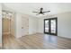 Spacious bedroom with wood floors, double doors, and modern lighting at 1312 W Van Buren Ave, Las Vegas, NV 89106