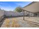 Spacious backyard featuring a covered patio and block wall for privacy at 1841 Golden Shadow Dr, Henderson, NV 89002