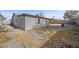 Home exterior featuring a covered patio and a large private backyard with block wall at 1841 Golden Shadow Dr, Henderson, NV 89002