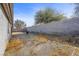 Large backyard featuring mature trees and a tall block wall for added privacy at 1841 Golden Shadow Dr, Henderson, NV 89002