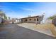 Expansive backyard featuring a covered patio and block wall for privacy at 1841 Golden Shadow Dr, Henderson, NV 89002