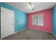 Bright bedroom with carpet floors, large window, and vibrant two-tone walls at 1841 Golden Shadow Dr, Henderson, NV 89002