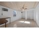 Cozy bedroom with wood panel ceiling, ceiling fan, and lots of natural light at 1841 Golden Shadow Dr, Henderson, NV 89002