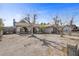 Charming single-story home with desert landscaping and mature trees in a residential neighborhood at 1841 Golden Shadow Dr, Henderson, NV 89002
