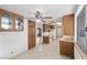 Spacious kitchen featuring tile flooring, ceiling fan, and plenty of cabinet space at 1841 Golden Shadow Dr, Henderson, NV 89002