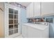 Laundry Room featuring washer, dryer, and exterior access door at 1841 Golden Shadow Dr, Henderson, NV 89002