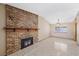 Bright living room features a classic brick fireplace and mantel, plus neutral paint at 1841 Golden Shadow Dr, Henderson, NV 89002