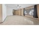 Open living space with tiled flooring, a large window, and plenty of room at 1841 Golden Shadow Dr, Henderson, NV 89002