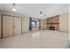 Bright living area with tiled floors, a brick fireplace, and large windows at 1841 Golden Shadow Dr, Henderson, NV 89002