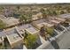 An aerial view of a neighborhood showcasing well-maintained homes with tile roofs at 2230 Spring Water Dr, Las Vegas, NV 89134