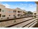 Balcony overlooking desert landscaping and tan community buildings at 2232 Aspen Mirror Way # 202, Laughlin, NV 89029