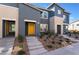 Stylish townhome featuring a modern design, desert landscaping, and steps leading to the entrance at 332 Pacific Sparrow Ave, Henderson, NV 89011