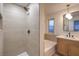 Modern bathroom featuring tiled shower and a coordinated vanity with stylish fixtures at 336 Merit Ct, Henderson, NV 89014