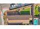 Aerial view of the backyard featuring an outdoor kitchen, pool, and entertaining area at 3491 Argiento Ave, Henderson, NV 89044