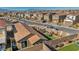 Aerial view of backyard featuring artificial turf, patio furniture, and a landscaped perimeter, surrounded by neighboring homes at 3491 Argiento Ave, Henderson, NV 89044