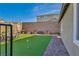Spacious backyard featuring manicured lawn, brick borders, and patio seating area, perfect for outdoor living at 3491 Argiento Ave, Henderson, NV 89044