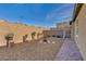 Spacious backyard with a well, brick-paved walkway, and a privacy wall for outdoor enjoyment at 3491 Argiento Ave, Henderson, NV 89044