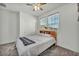 Inviting bedroom with a queen bed, ceiling fan, and view from the windows at 3491 Argiento Ave, Henderson, NV 89044