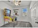 Playful bedroom with a vintage pinball machine, ceiling fan, and shelving for decorations at 3491 Argiento Ave, Henderson, NV 89044