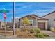 Charming single-story home featuring stone accents, desert landscaping, and street signage at 3491 Argiento Ave, Henderson, NV 89044