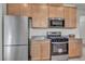 Well-equipped kitchen features stainless steel appliances, ample cabinet space, and granite countertops for meal preparation at 3491 Argiento Ave, Henderson, NV 89044