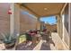 Inviting covered patio offering a comfortable seating area and access to the backyard at 3491 Argiento Ave, Henderson, NV 89044