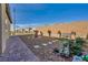 Sideyard featuring gravel, pavers, garden decor and a brick wall creating privacy at 3491 Argiento Ave, Henderson, NV 89044