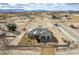 Aerial view of new construction home featuring a grand driveway and landscaping at 3520 Malibou Ave, Pahrump, NV 89048