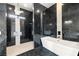 Gorgeous bathroom features marble tile, dual sinks, and a luxurious soaking tub and shower at 3520 Malibou Ave, Pahrump, NV 89048