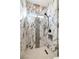 Beautiful bathroom with a gorgeous marble tiling, with black shower fixtures and a sleek modern design at 3520 Malibou Ave, Pahrump, NV 89048