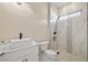 Modern bathroom with a sleek vessel sink, marble countertops, and a tiled shower at 3520 Malibou Ave, Pahrump, NV 89048