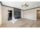 Expansive bedroom has a modern fireplace and access to bathrooms and closets at 3520 Malibou Ave, Pahrump, NV 89048