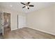Clean bedroom with a large closet with sliding doors, hardwood floors, and plenty of natural light at 3520 Malibou Ave, Pahrump, NV 89048