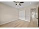 Clean bedroom with a large closet with sliding doors, hardwood floors, and plenty of natural light at 3520 Malibou Ave, Pahrump, NV 89048