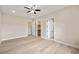 Spacious bedroom with a ceiling fan and access to the closet and bathroom at 3520 Malibou Ave, Pahrump, NV 89048