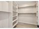 Walk-in closet with built-in shelving and hanging racks for organization at 3520 Malibou Ave, Pahrump, NV 89048