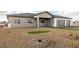 Charming single-story home featuring desert landscaping and a convenient three-car garage at 3520 Malibou Ave, Pahrump, NV 89048