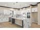 Bright kitchen with stainless steel appliances, a large island with seating and ample cabinet space at 3520 Malibou Ave, Pahrump, NV 89048