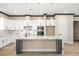 Modern kitchen with an island, stainless steel appliances, and white cabinets and neutral paint at 3520 Malibou Ave, Pahrump, NV 89048