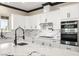 Spacious kitchen featuring marble countertops, modern fixtures, and stainless steel appliances at 3520 Malibou Ave, Pahrump, NV 89048