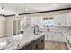 Bright kitchen with marble countertops, modern lighting, stainless steel appliances and mountain views at 3520 Malibou Ave, Pahrump, NV 89048