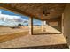 Relax on this covered patio with wood plank ceiling and enjoy the desert view at 3520 Malibou Ave, Pahrump, NV 89048