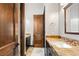 Elegant bathroom featuring double vanities with stone countertops and a separate toilet room at 5764 Aspen Falls Cir, Las Vegas, NV 89149