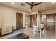 Bedroom with walk in closet, ceiling fan, tile floors, and sitting area at 5764 Aspen Falls Cir, Las Vegas, NV 89149