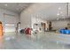 Huge garage with epoxy floor, large storage cabinets, and room for multiple cars at 5764 Aspen Falls Cir, Las Vegas, NV 89149