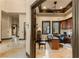 Bright home office featuring custom built-ins, a desk area, and backyard views at 5764 Aspen Falls Cir, Las Vegas, NV 89149